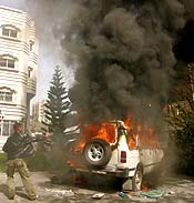 A Palestinian youth sets fire inside the British Council office in Gaza on Tuesday