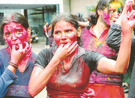 Girls play Holi on the Panjab University campus, Chandigarh, on Wednesday.