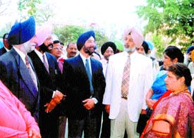 Members of the Old Students Association of Nawab Jassa Singh Ahluwalia College, including D.S. Jaspal, Principal Secretary, Public Relations Department (third from left), and Dr G.S. Aujala, DGP (Rules), Punjab (right), talking to the college staff in Kapurthala. 