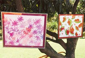 Paintings hang on trees at Mango Groove School
