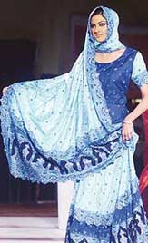 A Pakistani model displays a saree at a fashion show in Lahore on Thursday night.