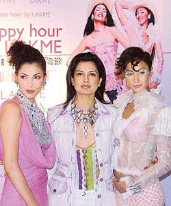 Designer Ritu Beri (centre) with models Indrani Dasgupta (left) and Shivani Kapoor at the launch of Lakmes fashion statement, Summer 2006, in New Delhi on Friday. 