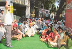 PCMS doctors hold a rally in front of the Civil Surgeons office in Ludhiana on Friday