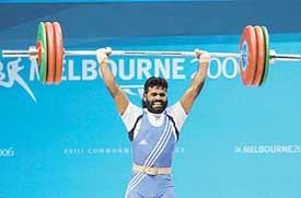 Arun Murugesan competes in the 62 kg weightlifting event at the Commonwealth Games on Friday. Arun won the silver, while Sri Lankas Chinthana Vidanage bagged the gold.