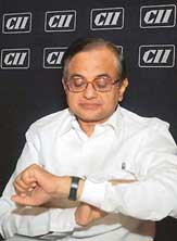 Finance Minister P. Chidambaram looks at his watch during the CIIs National Council meeting in New Delhi on Monday. 