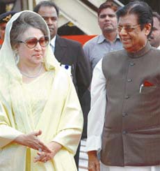 Bangladesh Prime Minister Begum Khaleda Zia is welcomed by E. Ahamed, Minister of State for External Affairs, on her arrival at Indira Gandhi International Airport in New Delhi
