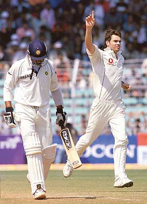 Englands James Anderson celebrates after taking the wicket of Harbhajan Singh on the third day of the third Test at the Wankhede Stadium in Mumbai on Monday.