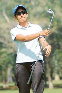 Kanika Minocha prepares for her approach shot at the ninth hole on the first day of the Chandigarh Open Ladies Amateur Golf Championship at the Chandigarh