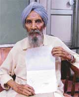 Darbara Singh with the court orders