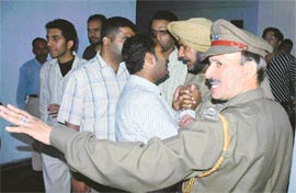 Panjab University security staff try to convince PUSU activists not to go on strike on Wednesday.