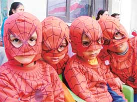Students wear dresses of spiderman at the annual function in St. Xavier Playway School in Ludhiana