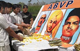 Members of the ABVP pay homage to Bhagat Singh, Rajguru and Sukhdev at Panjab University in Chandigarh on Thursday.