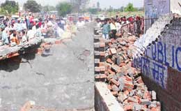 Personnel of PUDA carry out a demolition drive at Jhujhar Nagar in Mohali on Thursday.