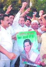 Congress activists protesting against the decision of Ms Sonia Gandhi to resign from the Lok Sabha outside her residence in the Capital on Thursday