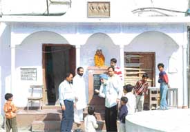 An elderly man narrates tale of the martyrs to children outside the ancestral house of Shaheed Sukhdev Thapar at Naughera Mohalla, Ludhiana, on Thursday