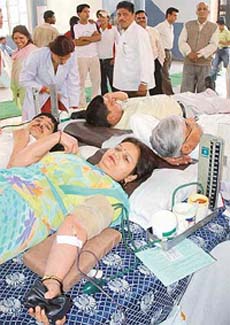 Volunteers donate blood at a blood donation camp at Garhwal bhavan in Sector 29, Chandigarh