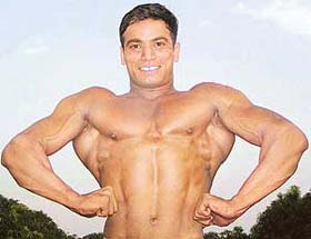 Mr Chandigarh Anurag Pandey shows his muscles during the body building competition at Sanjay Public School, Sector 70