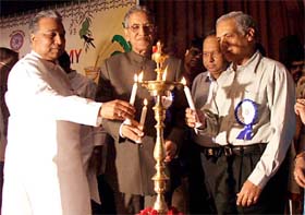 Union Minister of Company Affairs Prem Chand Gupta with Delhi Lt-Governor B.L.Joshi lighting the lamp to celebrate the 18th UGADI Festival, on the eve of Telegu New Year, organised by Delhi Telegu Academy in the Capital