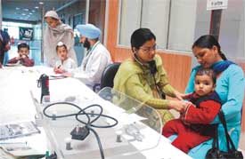 Doctors examine patients at a medical camp organised by SPS Apollo Hospitals in Ludhiana 
