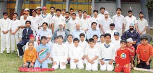 Mr Chaman Lal Malhotra, chairman, selection committee, Punjab( seniors), with the trainees attending a coaching camp on the PAU grounds on Sunday