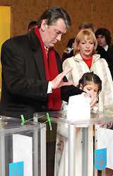 Ukrainian President Viktor Yushchenko casts his ballot during the parliamentary elections at a polling station in Kiev on Sunday