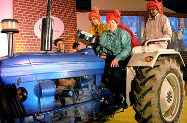 President Intel India Frank Jones drives a tractor at the launch of Intel Community PC in New Delhi on Wednesday