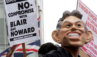 An Indonesian protester wears a mask of British Prime Minister Tony Blair during a rally outside the British Embassy in Jakarta on Wednesday