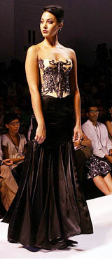 A model displays a creation by designer Lascelles Symons on the third day of the Lakme Fashion Week in Mumbai on Thursday