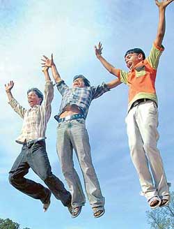 Slum children from Janata Colony express their joy after clearing Class V exams of the UT Education Department