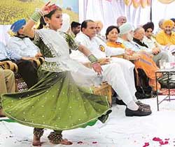 A girl performs at the inauguration of the Punjab Pollution Control Board building in Mohali