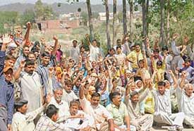 Residents of Kaimbwala village protest against a move by the Chandigarh Administration to demolish the houses outside the lal dora on Thursday