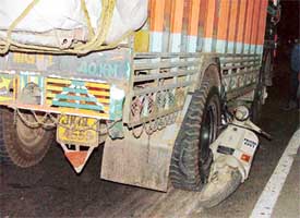 A scooter was crushed under a truck, killing two persons, near the Jalandhar by-pass on Wednesday