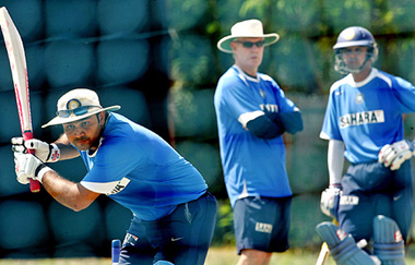 Rahul Dravid and Greg Chappell watch Virender Sehwag bat during a practice session in Faridabad on Thursday