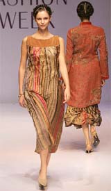 A model displays an outfit created by designer Soni on the fourth day of the Lakme Fashion Week in Mumbai