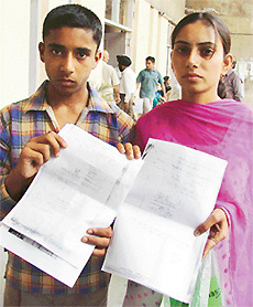 Karamjit Kaur and her brother Sandeep Kumar narrate their tale of woes to the Deputy Commissioner, Mr Anurag Verma, in Ludhiana on Friday