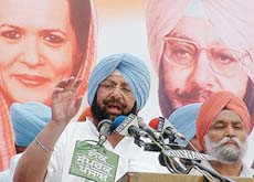 Punjab Chief Minister Amarinder Singh with MLA Sawinder Singh Kathunangal at a rally at Kathunangal, near Amritsar, on Friday. 