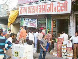 Liquor being sold openly on roads at Pathankot on Friday.