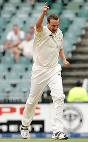 Australias Stuart Clark celebrates the dismissal of South Africas Boeta Dippenaar on the first day of the third Test in Johannesburg on Friday