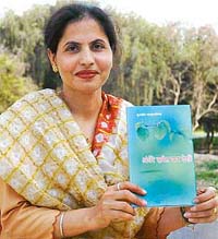 Kuldeep Ahluwalia poses with her book of poems in Chandigarh