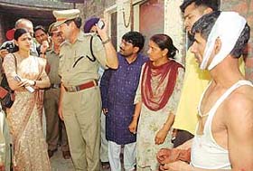 Ms Swati Sharma, SDM, listens to grievances of residents after they were lathicharged in Raipur Khurd