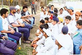 Trainees at the training-cum-coaching camp listen to R. S. Grewal, Deputy Director, Sports, PAU at the PAU cricket ground in Ludhiana