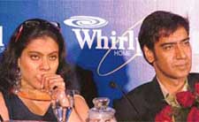 Bollywood actors Ajay Devgan and Kajol address media representatives at a Whirlpool product launch in New Delhi on Monday. Whirlpool announced that it would invest $20 m over the next 12 to 18 months for expanding its bouquet of products and launched a range of home appliances.