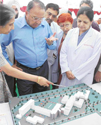 The UT Administrator, Gen S.F. Rodrigues (retd), inspects the model of the OPD block in General Hospital, Sector 16, Chandigarh, on Monday.