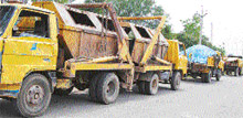 Garbage-collection vehicles stranded in Phase VIII-B, Industrial Area, Mohali, after residents protested against the dumping of garbage in the area on Monday.