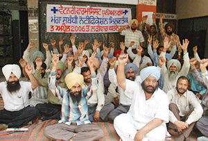 Members of the Veterinary Pharmacist Union, Punjab, protest at Sector 17 in Chandigarh on Monday.