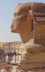 Workers carry out restoration works on the Great Sphinx of Giza in Egypt on Monday