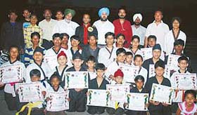 Participants of the Dragon Tiger Chinese Martial Arts Meet who were awarded belts at a function in Ludhiana