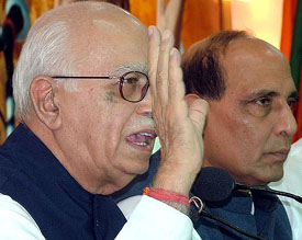 BJP leaders L.K. Advani and Rajnath Singh address a press conference on the eve of their Bharat Suraksha Yatra at BJP headquarter in New Delhi on Tuesday