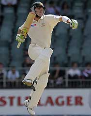 Australian batsman Damien Martyn celebrates his 100th run on the last day of the third Test at Wanderers stadium in Johannesburg on Tuesday