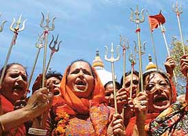 Members of the Nari Jagriti Manch, Chandigarh, holding "Trishul" as a mark of strength on the occasion of the Durga Asthmi at Sanatan Dharam Mandir, Sector 22 , Chandigarh, on Wednesday. 